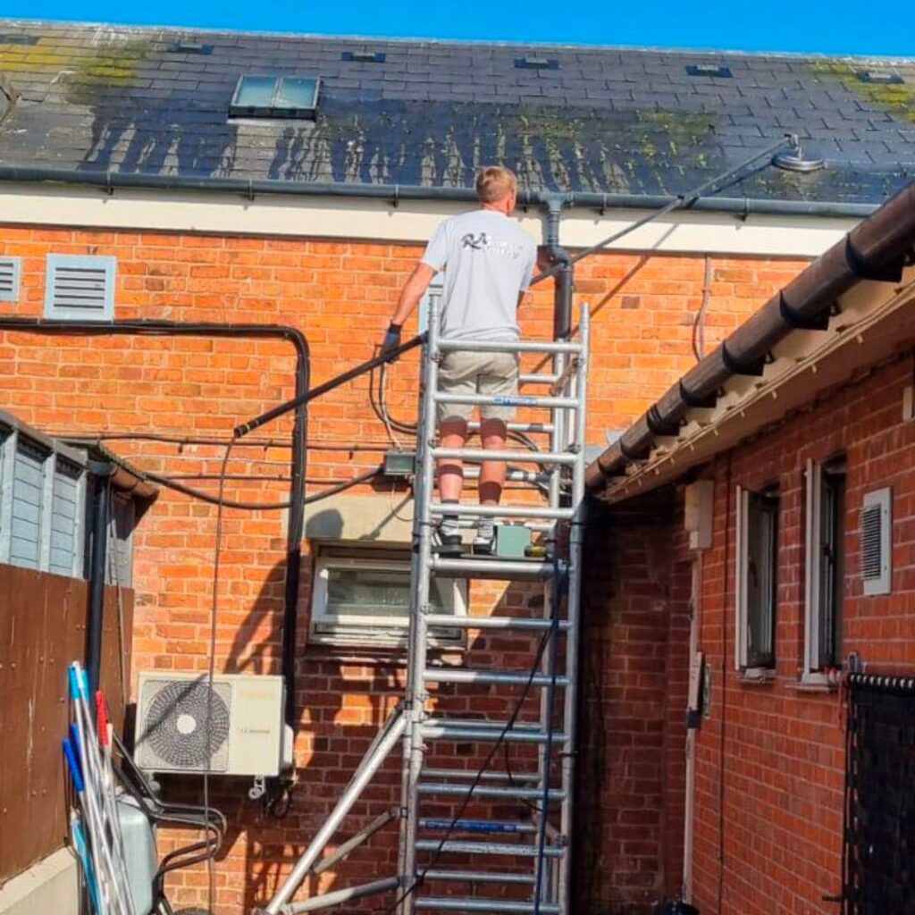 Expert roof cleaning in Bolton, eliminating dirt and moss for a refreshed roof appearance